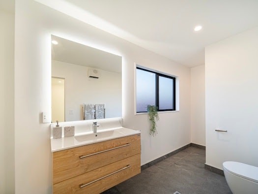 Modern bathroom renovation with floating timber vanity