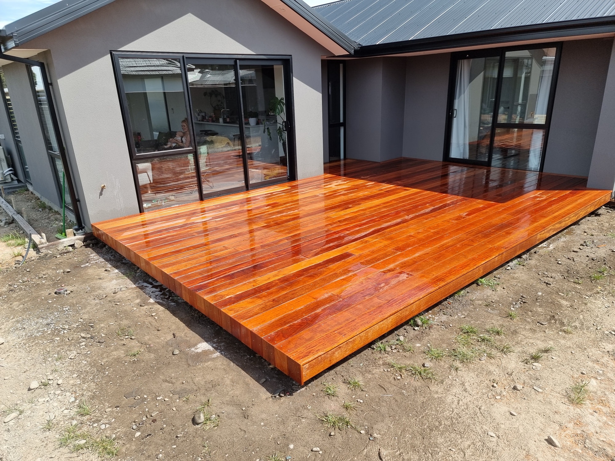 Wide hardwood deck with sliding door access